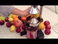 Squeezing Raw Juice With OrangeX Olympus Citrus Juicer