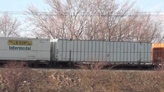 CSX Intermodal Train Roars By on Raised Tracks