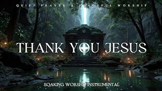 A lagoon in a darkened forest with an illuminated cross inside