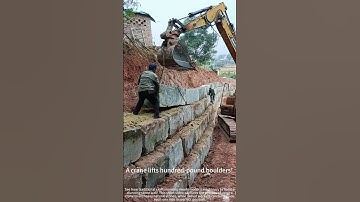 Building a stone wall with massive rocks! 🧱