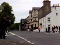 Moto gp bike at full throttle through the sulby straight