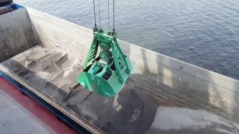 Clamshell grab handling Limestone at ArcelorMittal