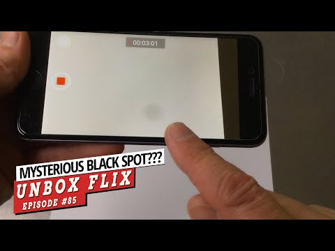 How do I get rid of the camera spot on my iPhone?