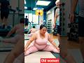 An older woman does yoga with a coach to lose weight and maintain a good figure. #60s #70s