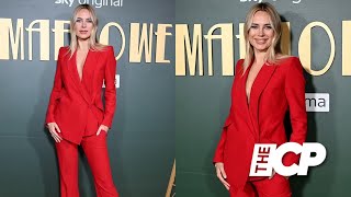 Kimberley Garner looks sensational in a plunging red suit