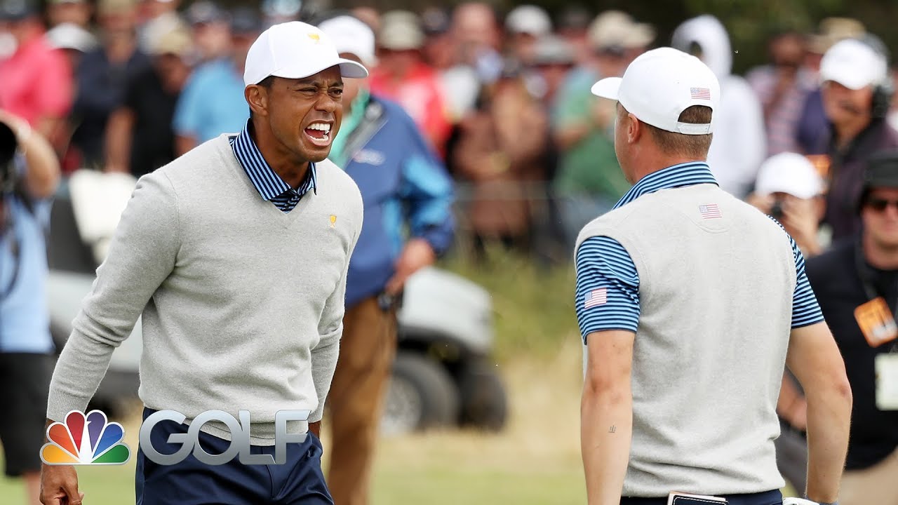 Tiger Woods watches as Justin Thomas drains putt to win vital point
