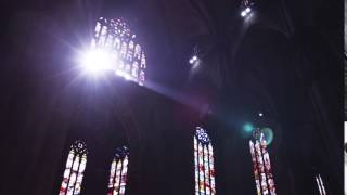 Sun shining through windows of a church in Milan, Italy.