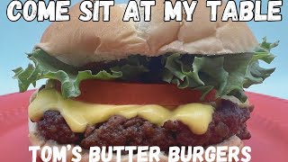 Tom’s Butter Burgers - Join us on the back porch for a moist and delicious cheeseburger!