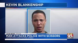 Man Attacks Police With Scissors