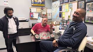 Darius Carter sits with Mr. Bellini to boast about the recent success of W.O.W