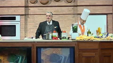 Humorous culinary demo in Diamond Princess theatre 