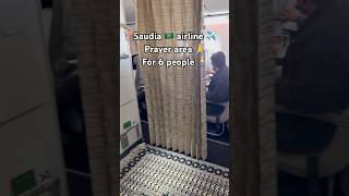 Saudia airline prayer area at the back of the airplane