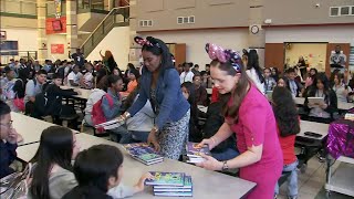 Disneys Magic of Storytelling brings boxes of books to 6th graders in Spring