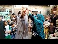 النجعاوية خادمة آل البيت تجوب الموالد وتنافس الرجال بالرقص على العصا في نجع حمادي