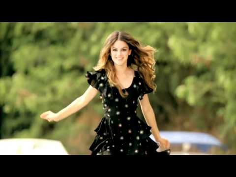 Woman walking barefoot over cars in traffic