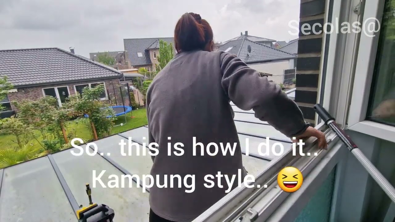 Glass roof cleaning using high-pressure cleaner.