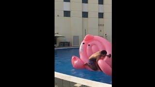 Guy Hilariously Trying To Get On A Giant Floatie In The Pool