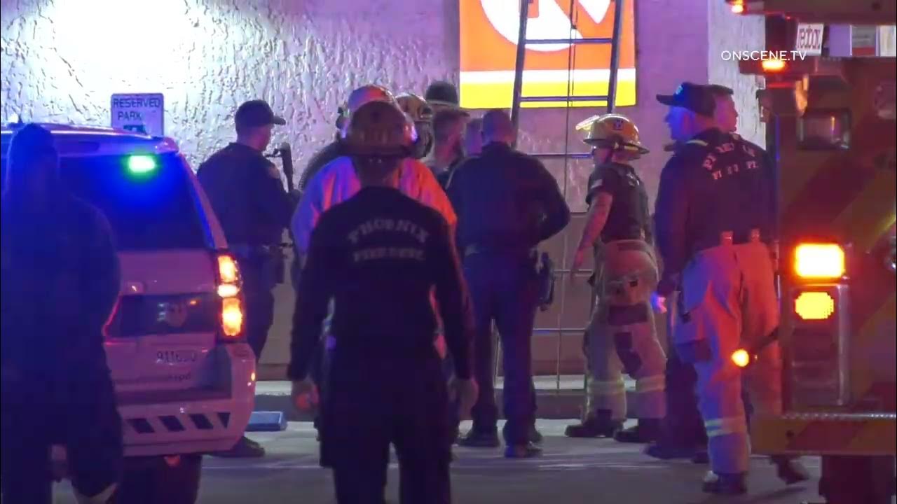 Standoff on Phoenix Gas Station Roof Suspect Throws PVC Pipes at