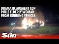 Dramatic moment cop pulls elderly woman from burning vehicle