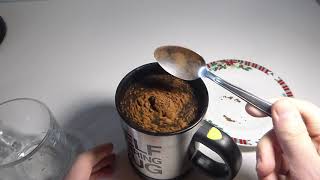 Self Stirring Mug. Vortex Centripetal Force Mixing Water and Cocoa Powder