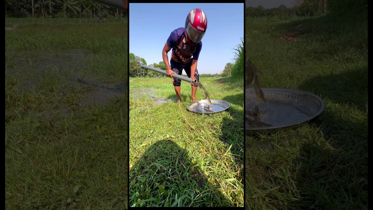 Fishing with plastic pipe while wearing a helmet in the bill 