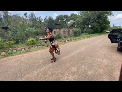 African lady ululates on  Ugandan street.