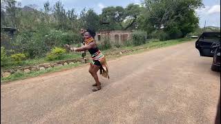 African lady ululates on  Ugandan street.