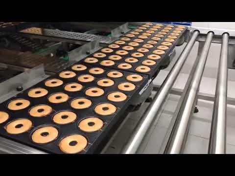 Stacking Donuts To Make A Cake