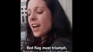 Woman on accordion sings Bandiera Rossa on balcony