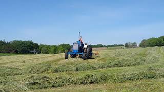 Ford 8000 raking hay
