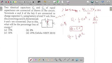 Two identical capacitors C1 and C2 of equal capacitance are connected as shown in the circuit. Termi