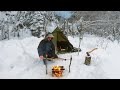 Hot tent camping in a snowstorm  bushcraft hobo rod ice fishing  catch cook  camp