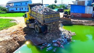 excellently full two project landfill build house !team truck unload ,bulldozer d20p push stone soil