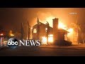 More than 27K evacuated as fire destroys town