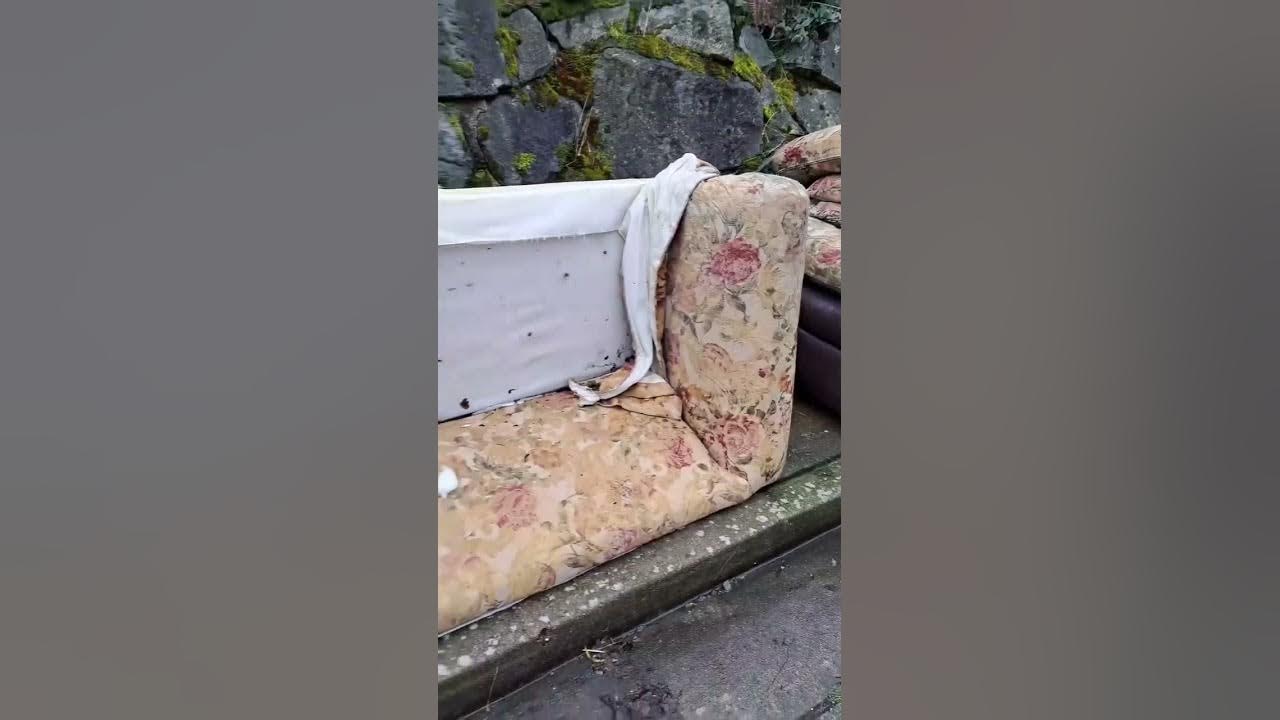 Abandoned couch gets deconstructed to minimize size heading to landfill