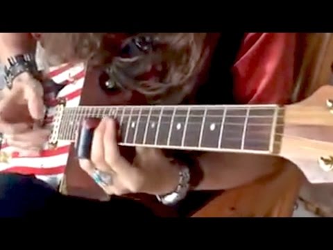 Comment jouer Slide Guitar Tuning dans la norme | DIRECT
