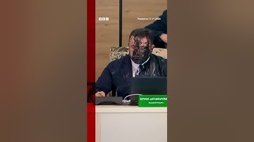 Moment Georgia election chief doused in paint by opposition official. #Georgia #BBCNews
