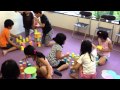 Mastering the alphabet and building tower using paper cups.