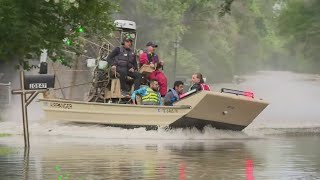 Airboats navigate streets in Montgomery County neighborhood as floodwaters rise