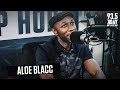 Aloe blacc on unreleased album birds eye view wexile success with singing over rapping