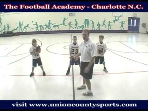 www.youthfootballhandbook.com - The Football Academy instructs youth athletes on Football Technique, Speed & Agility and physical conditioning ina year round program. For addition information please visit www.unioncountysports.com. In this video Coach Erik Saunders works through a basic ball handling drill.