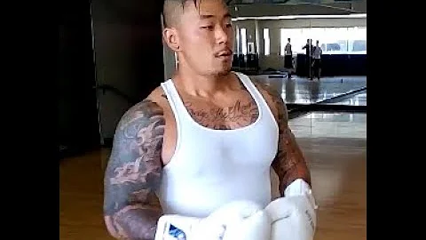 Asian Musclehead knocks Charlie Zelenoff across the hall with a straight right 2014