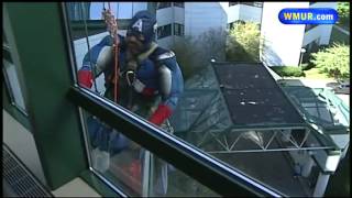 Superheros wash windows to surprise patients at CHaD