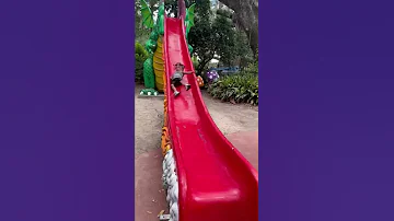 Kid Hits Head on Side of Slide - 1337813
