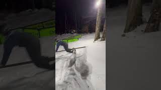 Snowboarder attempts to grind rail but board gets stuck causing him to fall forward and hit his face