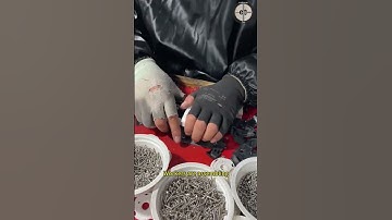 Workers are assembling building measuring tools: tape measure