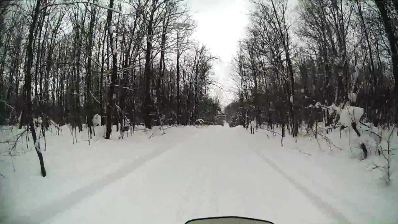 Riding snowmobile between Bergland, MI and Lake of the Clouds Porcupine Mountans on trail 102
