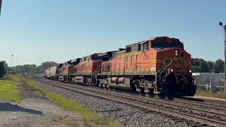 BNSF 4086 leads WB grain with rare BNSF 619 AC44C4M at Savanna