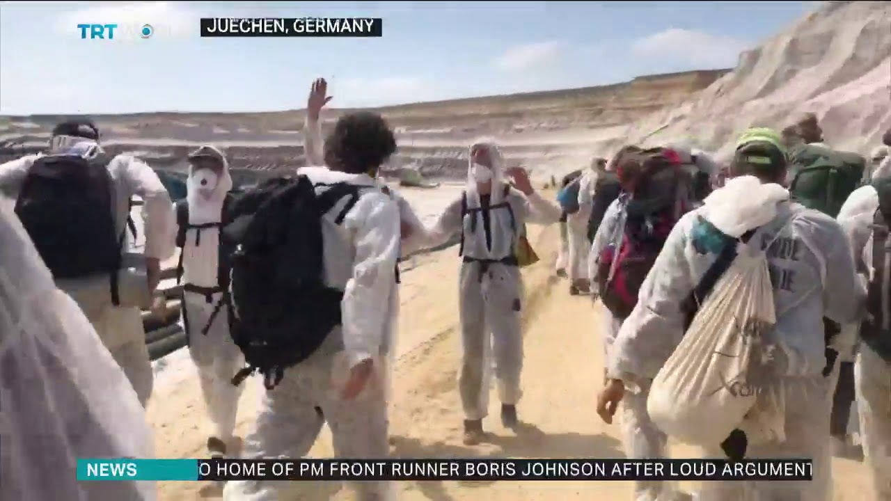 Climate protesters and police clash at Germany mine newspaper mockup