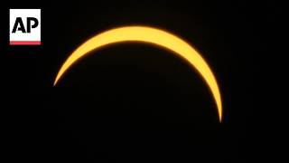 Timelapse video shows a partial solar eclipse in London